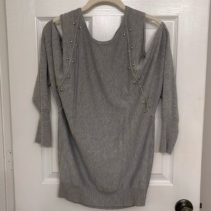 Jennifer Lopez size medium gray peel shoulder sweater.